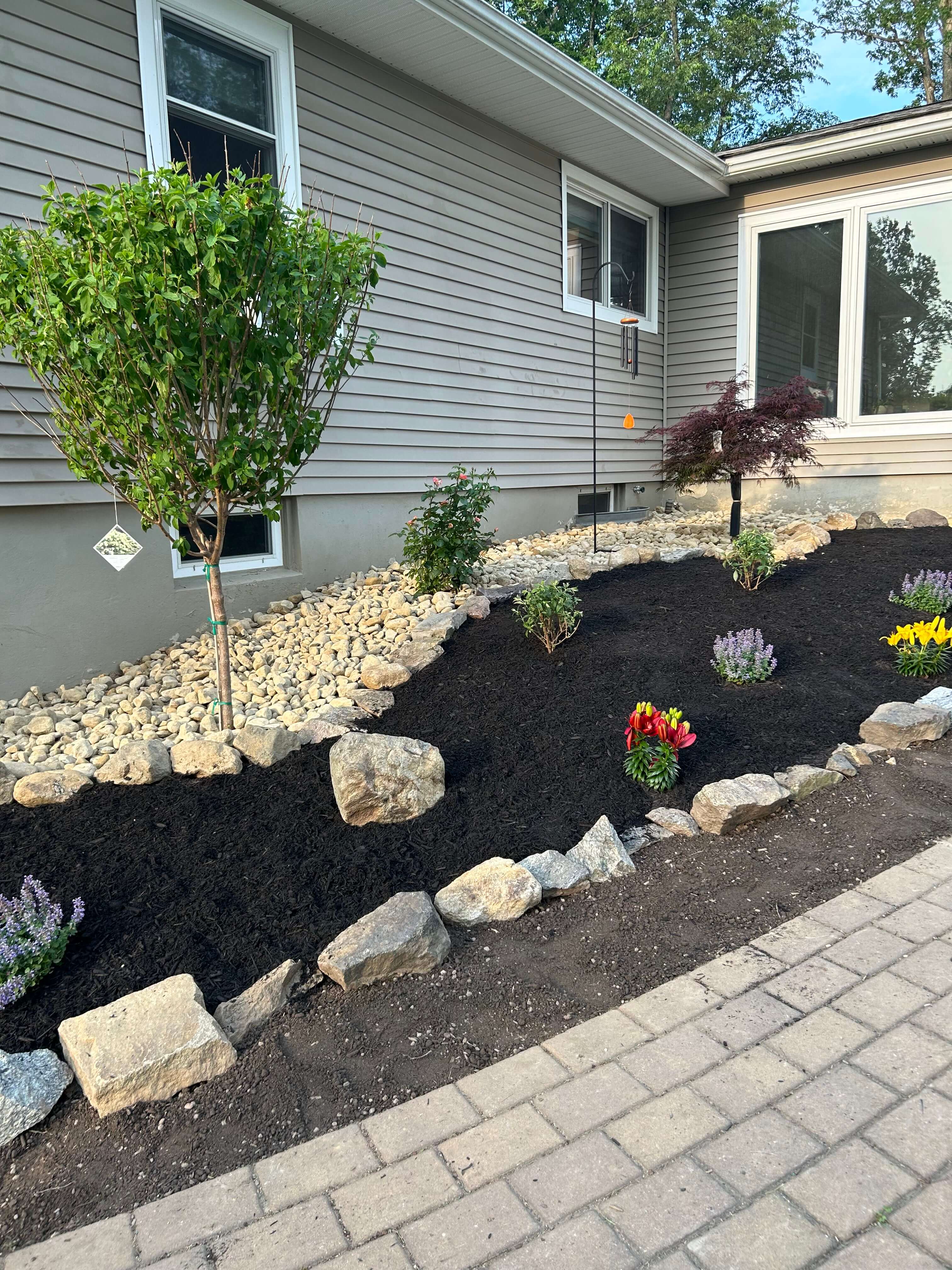 Decorative landscape rock and mulch beds by Home Care With A Vision